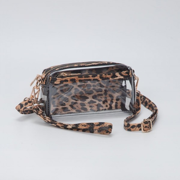 Clear Vegan Crossbody Wristlet Clutch

- Zip Closure
- Removable Straps: Leather & Canvas
- Approximately 4" T X 7" L X 2" W
- Straps Adjustable: 30" L

