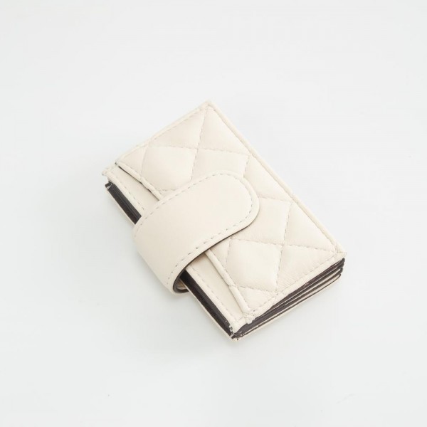 Quilted Vegan Leather Snap Card Holder

- One Outer Pocket
- Four Card Holders 
- Approximately 4" L x 3" T
