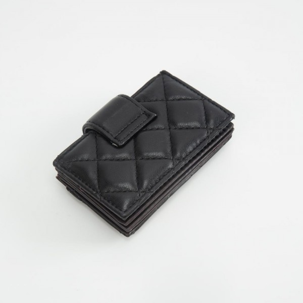 Quilted Vegan Leather Snap Card Holder

- One Outer Pocket
- Four Card Holders 
- Approximately 4" L x 3" T