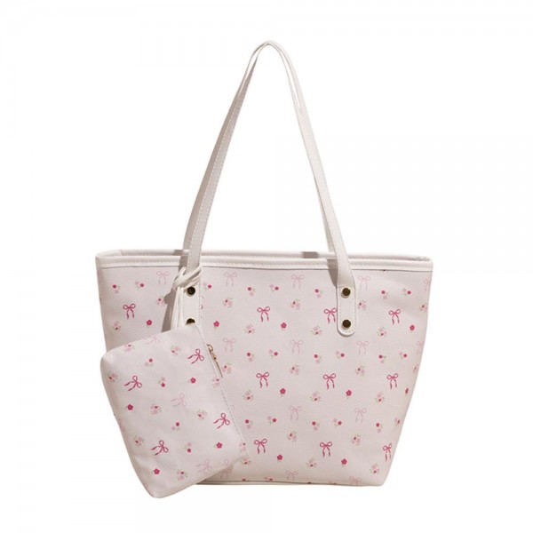 Bow & Flower Print Vegan Leather Tote Bag 

- Full Zip Closure
- Lined Body 
- Matching Wristlet Included 
- Approximately 15" L X 7" T X 4" D

