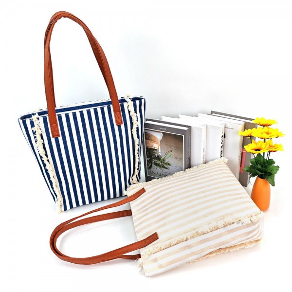 Stripe Canvas Tote Bag With Fringe Detail & Vegan Leather Handles 

- Full Zip Closure
- Lined Body 
- 1 Open Pocket 
- Approximately 10" L X 13" T X 3.25" D