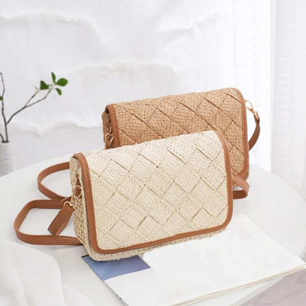 Woven Straw Tote Bag With Vegan Leather Details 

- Snap Closure
- Lined Body with Open Pocket
- Removable Cross Body Strap 
- Approximately 9" L X 6.5" T X 2.5" D
