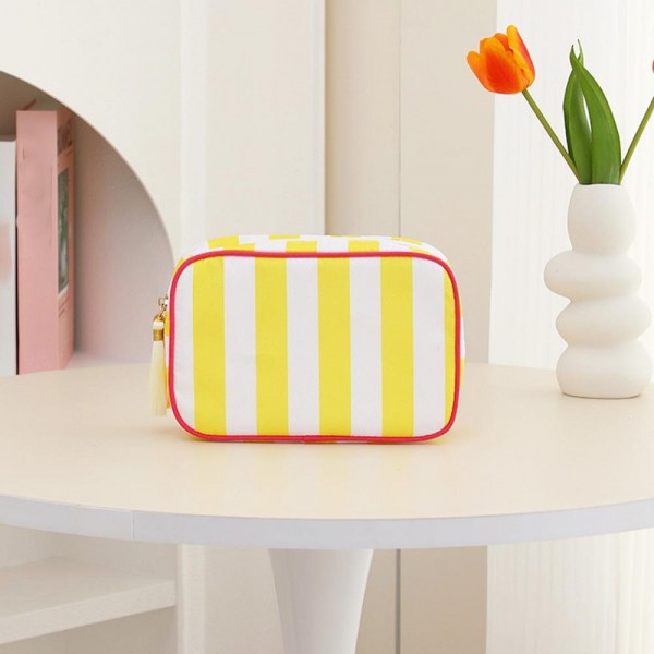 Nylon Stripe Pouch With Tassel 

- Fill Zip Closure 
- Lined Body with Open Pocket 
- Approximately 9" L X 7" T X 3" D