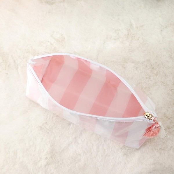 Checker Pouch With Tassel

- Fill Zip Closure
- Approximately 11" L X 5.75" T X 3.5" D