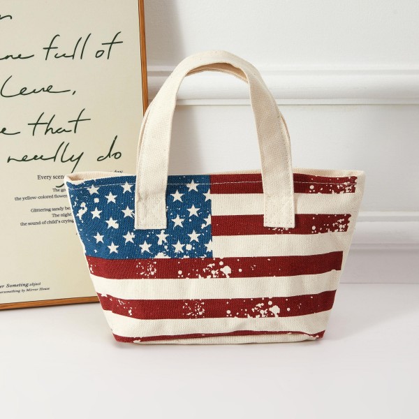 A striking canvas mini tote with bold all-over American flag coverage — stars-and-stripes from top to bottom for maximum patriotic impact. Lightweight with sturdy top handles, this carryall is designed for summer celebrations, beachside outings, and seasonal gifting. Appeals to shoppers with a strong patriotic sensibility and sells especially well during Fourth of July and Memorial Day selling periods. An easy add-on that strengthens any Americana-themed summer display.