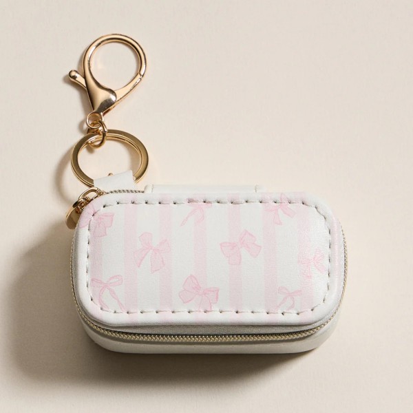Vegan Leather Stripes & Bows Print Jewelry Box Key Ring 

- Full Zip Closure 
- Earring Holder 
- 2 Ring Slots 
- Approximately 1.5" T X 3" L
