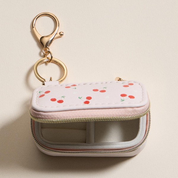 Vegan Leather Cherries & Hearts Print Jewelry Box Key Ring 

- Full Zip Closure 
- Earring Holder 
- 2 Ring Slots 
- Approximately 1.5" T X 3" L