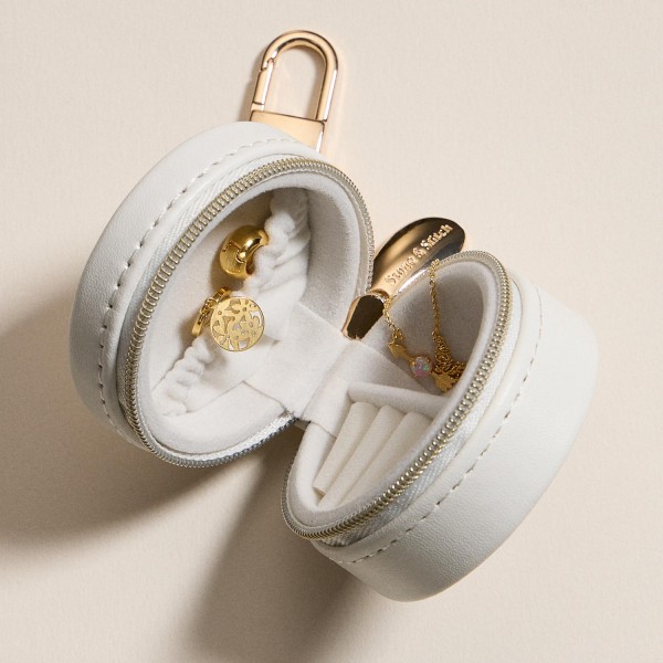 Vegan Leather Flowers Print Jewelry Box Key Ring 

- Full Zip Closure 
- Earring Holder 
- 3 Ring Slots 
- Approximately 2.25" T X 2.25" L