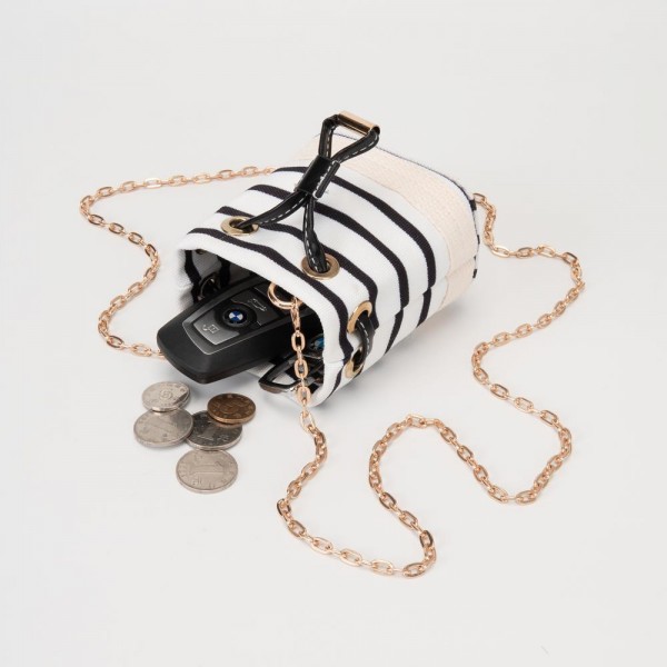 Mini Canvas Cross Body Bucket Bag

- Drawstring Closure
- Removable Chain Link Crossbody Strap
- Approximately 3.5" L X 4" T X 2.5" D