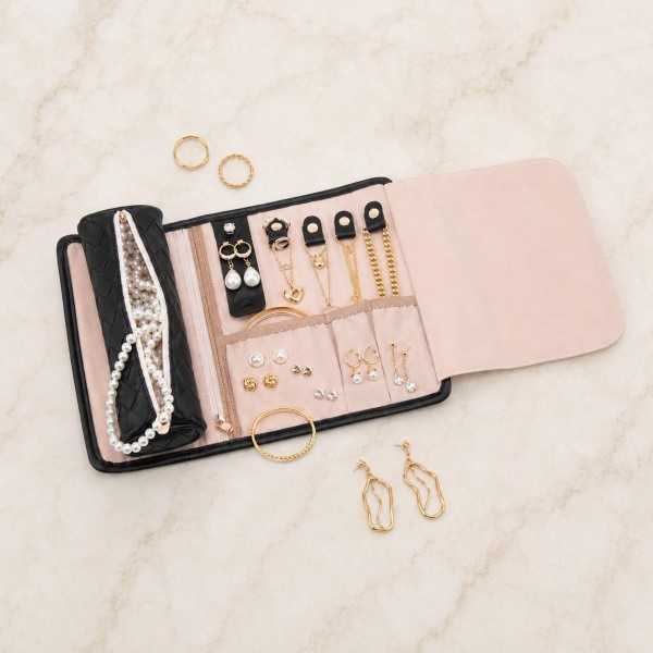 Woven Vegan Leather Roll Up Jewelry Organizer 

- Metal & Plastic Buckle Closure
- 2 Snap Ring Holders 
- 4 Earrings Holders 
- 3 Snap Necklace Holders 
- 1 Zip Pocket 
- 1 Open Pocket 
- Velvet Divider 
- Woven Vegan Leather Cylinder Pouch Included 
- Approximately 8.75" L X 3" T X 2.5" D
