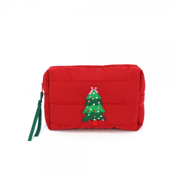 Quilted puffer bag with a padded body and an embroidered trimmed tree on the front. Sold as a padded tote and a matching zip pouch so she can carry the big one and keep the small one in it. A seasonal carry for boutique buyers stocking hostess gifts, teacher gifts, cookie exchanges, and holiday markets. Puffy quilted bags are light, wipe clean, and ring up as the easy grab and go gift all December.
