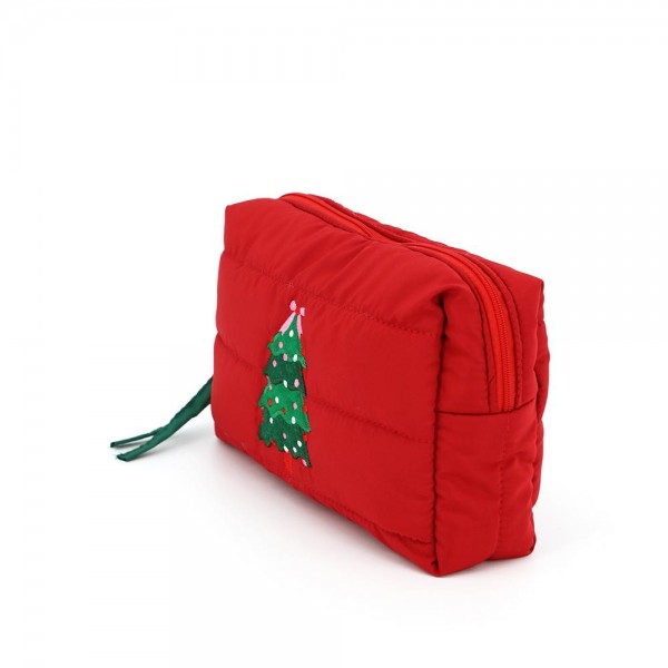 Quilted puffer bag with a padded body and an embroidered trimmed tree on the front. Sold as a padded tote and a matching zip pouch so she can carry the big one and keep the small one in it. A seasonal carry for boutique buyers stocking hostess gifts, teacher gifts, cookie exchanges, and holiday markets. Puffy quilted bags are light, wipe clean, and ring up as the easy grab and go gift all December.