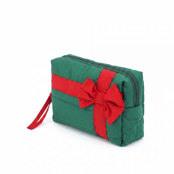 Quilted puffer bag styled like a wrapped present, with a contrast ribbon band and an oversized bow. Sold as a padded tote and a matching zip pouch so she can carry the big one and keep the small one in it. A seasonal carry for boutique buyers stocking hostess gifts, teacher gifts, cookie exchanges, and holiday markets. Puffy quilted bags are light, wipe clean, and ring up as the easy grab and go gift all December.