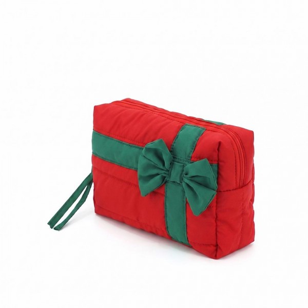 Quilted puffer bag styled like a wrapped present, with a contrast ribbon band and an oversized bow. Sold as a padded tote and a matching zip pouch so she can carry the big one and keep the small one in it. A seasonal carry for boutique buyers stocking hostess gifts, teacher gifts, cookie exchanges, and holiday markets. Puffy quilted bags are light, wipe clean, and ring up as the easy grab and go gift all December.