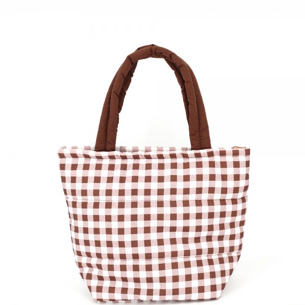 Quilted puffer bag in a checked gingham print with a padded body and matching padded handles. Sold as a padded tote and a matching zip pouch so she can carry the big one and keep the small one in it. A seasonal carry for boutique buyers stocking hostess gifts, teacher gifts, cookie exchanges, and holiday markets. Puffy quilted bags are light, wipe clean, and ring up as the easy grab and go gift all December.