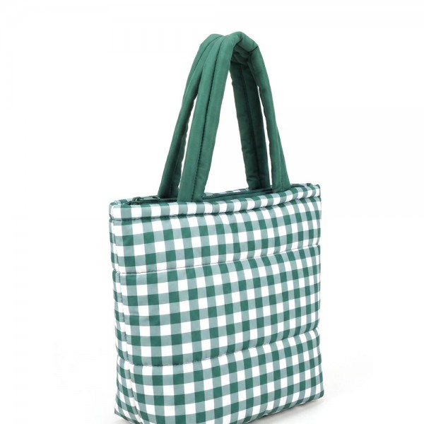 Quilted puffer bag in a checked gingham print with a padded body and matching padded handles. Sold as a padded tote and a matching zip pouch so she can carry the big one and keep the small one in it. A seasonal carry for boutique buyers stocking hostess gifts, teacher gifts, cookie exchanges, and holiday markets. Puffy quilted bags are light, wipe clean, and ring up as the easy grab and go gift all December.