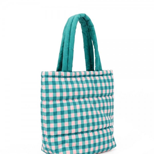 Quilted puffer bag in a checked gingham print with a padded body and matching padded handles. Sold as a padded tote and a matching zip pouch so she can carry the big one and keep the small one in it. A seasonal carry for boutique buyers stocking hostess gifts, teacher gifts, cookie exchanges, and holiday markets. Puffy quilted bags are light, wipe clean, and ring up as the easy grab and go gift all December.