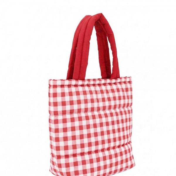 Quilted puffer bag in a checked gingham print with a padded body and matching padded handles. Sold as a padded tote and a matching zip pouch so she can carry the big one and keep the small one in it. A seasonal carry for boutique buyers stocking hostess gifts, teacher gifts, cookie exchanges, and holiday markets. Puffy quilted bags are light, wipe clean, and ring up as the easy grab and go gift all December.