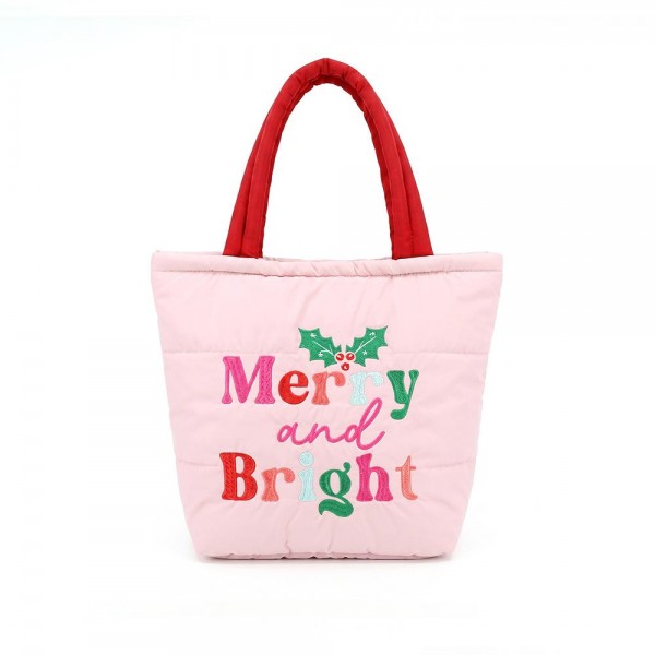Quilted puffer bag with a padded body and an embroidered holiday greeting across the front. Sold as a padded tote and a matching zip pouch so she can carry the big one and keep the small one in it. A seasonal carry for boutique buyers stocking hostess gifts, teacher gifts, cookie exchanges, and holiday markets. Puffy quilted bags are light, wipe clean, and ring up as the easy grab and go gift all December.