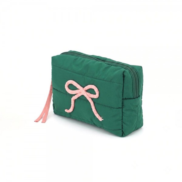 Quilted puffer bag with a padded body and an applique bow across the front. Sold as a padded tote and a matching zip pouch so she can carry the big one and keep the small one in it. A seasonal carry for boutique buyers stocking hostess gifts, teacher gifts, cookie exchanges, and holiday markets. Puffy quilted bags are light, wipe clean, and ring up as the easy grab and go gift all December.