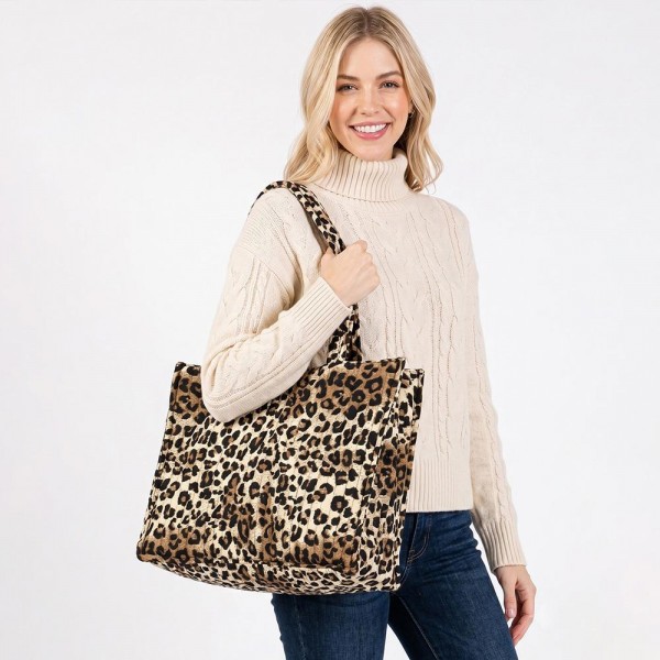 Leopard Print Puffer Quilted Tote Bag 

- 1 Internal Open Pocket 
- 1 Internal Zip Pocket 
- Approximately 16" L X 12" T X 6.75" D 
- 100% Polyester 