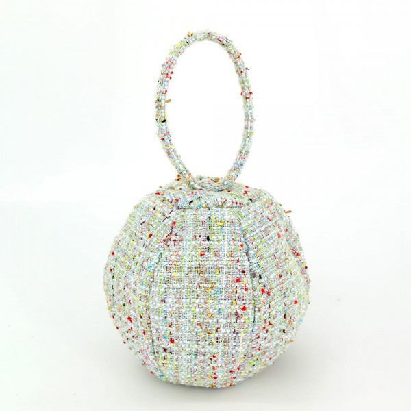 Tweed ball bag with a matching round top handle and a hidden zip closure. Rounded dome shape sits upright on a shelf and holds a phone, cards, and a lipstick for a night out. A dressed up piece for boutique buyers stocking holiday parties, weddings, showers, and gallery nights. Sculptural tweed bags stop customers at the display and sell as a gift or a treat.