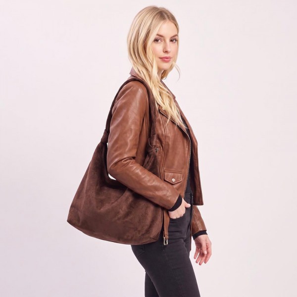 Suede shoulder bag with a soft slouch body, wide strap, and a clean minimal front. Roomy main compartment holds a wallet, phone, and sunglasses without looking bulky under the arm. An everyday carry for boutique buyers stocking travel, campus, farmers markets, and weekend errands. Soft suede shoulder bags are the shape customers come back for in every neutral.