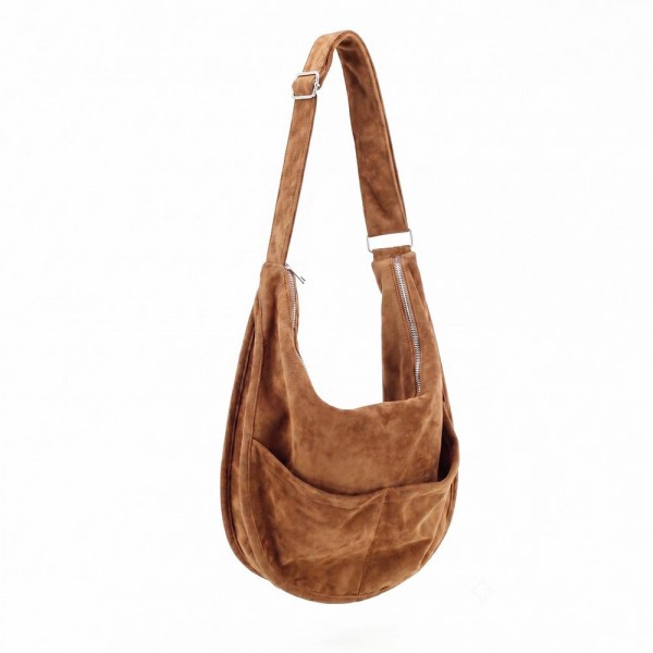 Slouchy suede hobo bag with a wide adjustable strap and a soft unstructured body. Roomy main compartment swallows a wallet, sunglasses, and a water bottle, and the pillow soft body sits close without pulling at the shoulder. An everyday carry for boutique buyers stocking travel, campus, farmers markets, and weekend errands. Soft hobo bags are the shape customers come back for, and the neutral run sells across every outfit.