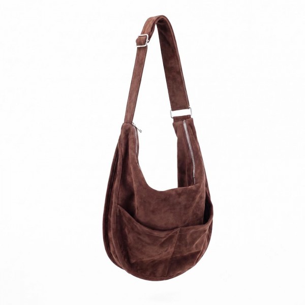 Slouchy suede hobo bag with a wide adjustable strap and a soft unstructured body. Roomy main compartment swallows a wallet, sunglasses, and a water bottle, and the pillow soft body sits close without pulling at the shoulder. An everyday carry for boutique buyers stocking travel, campus, farmers markets, and weekend errands. Soft hobo bags are the shape customers come back for, and the neutral run sells across every outfit.