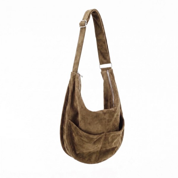 Slouchy suede hobo bag with a wide adjustable strap and a soft unstructured body. Roomy main compartment swallows a wallet, sunglasses, and a water bottle, and the pillow soft body sits close without pulling at the shoulder. An everyday carry for boutique buyers stocking travel, campus, farmers markets, and weekend errands. Soft hobo bags are the shape customers come back for, and the neutral run sells across every outfit.
