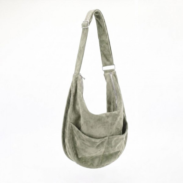 Slouchy suede hobo bag with a wide adjustable strap and a soft unstructured body. Roomy main compartment swallows a wallet, sunglasses, and a water bottle, and the pillow soft body sits close without pulling at the shoulder. An everyday carry for boutique buyers stocking travel, campus, farmers markets, and weekend errands. Soft hobo bags are the shape customers come back for, and the neutral run sells across every outfit.