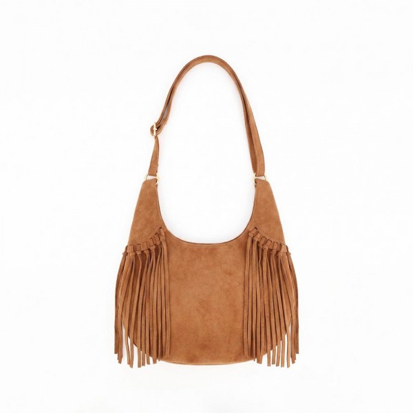 Fringe hobo bag in a soft vegan suede with a slouchy crescent body and a long shoulder strap. Roomy enough for a wallet, sunglasses, and a water bottle, with fringe along the base that moves as she walks. A western leaning piece for boutique buyers stocking concerts, rodeos, festivals, and fall travel. Fringe bags are the accessory customers photograph, and they reorder every fall.