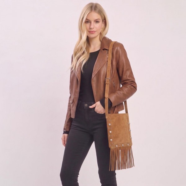 Fringe crossbody bag in a soft vegan suede with a long adjustable strap and studded trim. Slim body carries a phone, wallet, and keys, while the extra long fringe sways with every step. A western leaning piece for boutique buyers stocking concerts, rodeos, festivals, and fall travel. Fringe bags are the accessory customers photograph, and they reorder every fall.
