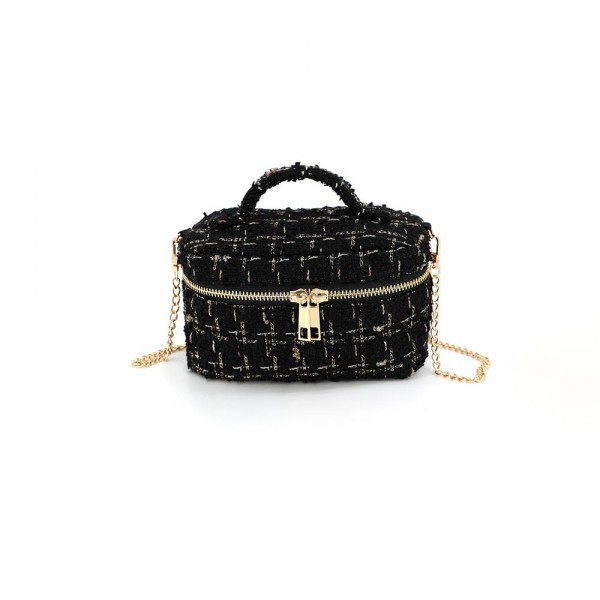 Tweed vanity box bag with a gold tone chain strap, top zip closure, and a knotted top handle. Structured oval shape holds its form on a shelf and opens flat for a phone, cards, and a lipstick. A dressed up piece for boutique buyers stocking holiday parties, weddings, showers, and gallery nights. Structured tweed bags photograph beautifully and sell as the gift a customer keeps for herself.