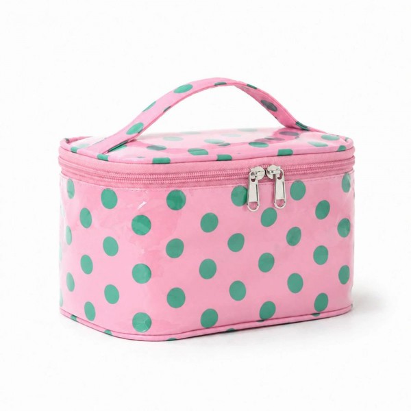 Polka dot train case with a zip around lid, a top carry handle, and a roomy single compartment that stands up on its own. The coated exterior wipes clean in seconds and the flat base keeps it steady on a bathroom counter or a hotel vanity. It holds a full daily routine plus brushes without squashing anything. A tidy gift item that sells on looks alone and pairs naturally with a matching tote.