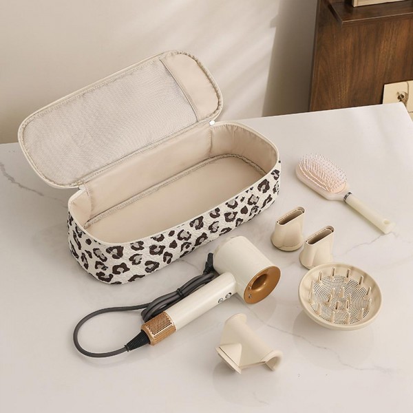 Structured travel cosmetic case with a full zip lid, a top carry handle, and a wipe clean lining that shrugs off spills. The long rectangular shape stands brushes, palettes, and full size bottles upright instead of leaving them jumbled flat. Sturdy enough to pack in a suitcase and pretty enough to leave out on a vanity. A strong standalone gift and an easy upsell next to a matching tote.