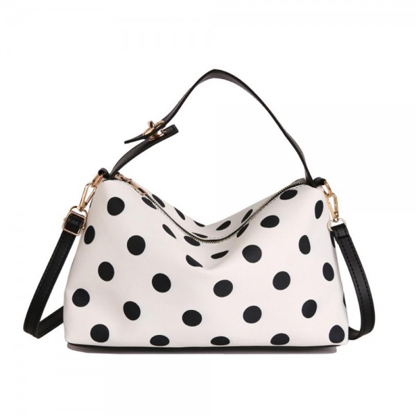 Polka dot shoulder bag with a soft slouchy body, a top zip closure, and a removable strap so it wears on the shoulder or across the chest. The interior swallows a wallet, phone, and everyday essentials without bulking out through the middle. A printed take on the classic hobo shape that feels current without chasing a trend too hard. Easy to merchandise beside the matching cosmetic cases for a quick two piece sale.