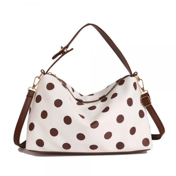 Polka dot shoulder bag with a soft slouchy body, a top zip closure, and a removable strap so it wears on the shoulder or across the chest. The interior swallows a wallet, phone, and everyday essentials without bulking out through the middle. A printed take on the classic hobo shape that feels current without chasing a trend too hard. Easy to merchandise beside the matching cosmetic cases for a quick two piece sale.
