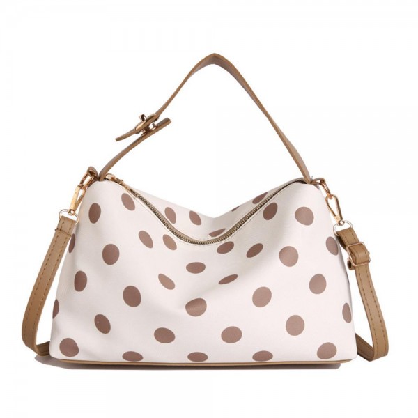 Polka dot shoulder bag with a soft slouchy body, a top zip closure, and a removable strap so it wears on the shoulder or across the chest. The interior swallows a wallet, phone, and everyday essentials without bulking out through the middle. A printed take on the classic hobo shape that feels current without chasing a trend too hard. Easy to merchandise beside the matching cosmetic cases for a quick two piece sale.