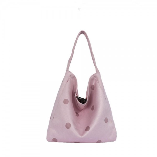 Polka Dot Hobo Tote with a soft slouchy silhouette, a single shoulder strap, and a spacious interior for wallets, water bottles, and everyday extras. The scattered dot print adds a playful touch to simple outfits, from jeans and sweaters to casual dresses. Lightweight and easy to carry from workday to weekend. Slouchy hobo shapes are back in demand, and this one delivers an on trend look at a price that makes it an easy add for any boutique bag display.