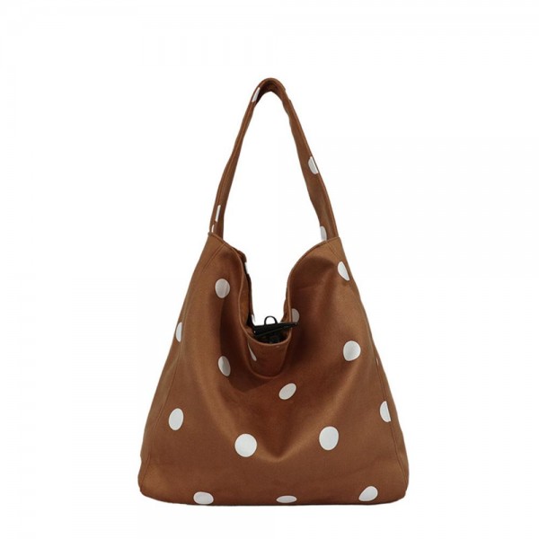 Polka Dot Hobo Tote with a soft slouchy silhouette, a single shoulder strap, and a spacious interior for wallets, water bottles, and everyday extras. The scattered dot print adds a playful touch to simple outfits, from jeans and sweaters to casual dresses. Lightweight and easy to carry from workday to weekend. Slouchy hobo shapes are back in demand, and this one delivers an on trend look at a price that makes it an easy add for any boutique bag display.