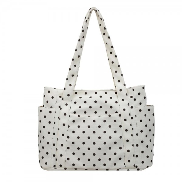 Quilted polka dot tote bag with a roomy main compartment, twin shoulder straps, and open side pockets sized for a phone or a water bottle. The lightweight body holds its shape when packed and folds down flat for storage between trips. A practical everyday carry that covers work, the gym, and weekend errands without looking like a gym bag. Printed totes at this price point move well as an add on beside the register.