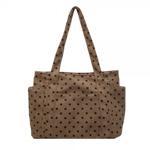 Quilted polka dot tote bag with a roomy main compartment, twin shoulder straps, and open side pockets sized for a phone or a water bottle. The lightweight body holds its shape when packed and folds down flat for storage between trips. A practical everyday carry that covers work, the gym, and weekend errands without looking like a gym bag. Printed totes at this price point move well as an add on beside the register.