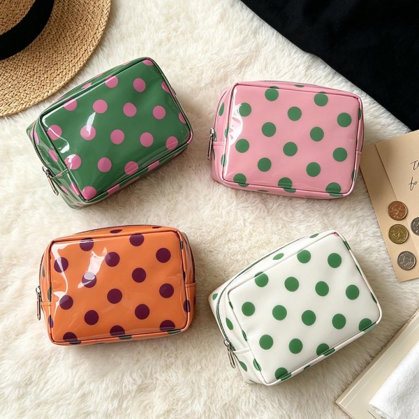 Polka Dot Boxy Cosmetic Pouch with a glossy coated finish, a smooth zip closure, and a compact square shape that sits neatly in a drawer or suitcase. Sized just right for makeup, hair ties, chargers, or travel toiletries, and the wipe clean surface handles leaky products with ease. Toss it in a tote, carry on, or gym bag for instant organization. A cute, affordable gift that boutique shoppers love to buy in multiples.