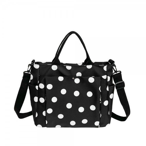 Polka Dot Nylon Crossbody Tote with dual top handles, an adjustable shoulder strap, and plenty of exterior pockets for a phone, water bottle, and keys. The lightweight fabric and roomy interior make it a smart pick for travel days, sports practice, errands, and diaper bag duty. Carry it by hand or wear it crossbody when you need to stay hands free. A practical, playful bag that busy moms and teachers love, priced to move quickly.