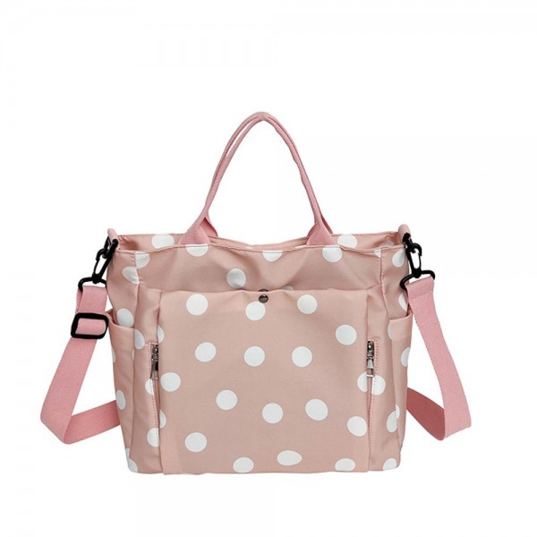 Polka Dot Nylon Crossbody Tote with dual top handles, an adjustable shoulder strap, and plenty of exterior pockets for a phone, water bottle, and keys. The lightweight fabric and roomy interior make it a smart pick for travel days, sports practice, errands, and diaper bag duty. Carry it by hand or wear it crossbody when you need to stay hands free. A practical, playful bag that busy moms and teachers love, priced to move quickly.