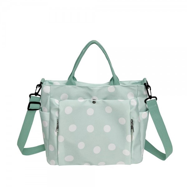 Polka Dot Nylon Crossbody Tote with dual top handles, an adjustable shoulder strap, and plenty of exterior pockets for a phone, water bottle, and keys. The lightweight fabric and roomy interior make it a smart pick for travel days, sports practice, errands, and diaper bag duty. Carry it by hand or wear it crossbody when you need to stay hands free. A practical, playful bag that busy moms and teachers love, priced to move quickly.