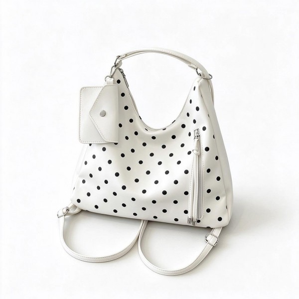 Polka Dot Convertible Hobo Backpack in soft faux leather with a slouchy silhouette, sturdy top handle, and adjustable straps that switch it to a hands free backpack in seconds. A side zip pocket with a tassel pull and a matching mini card pouch keep keys, cards, and lip balm within easy reach. Carry it to work, class, or on a weekend getaway. A versatile two in one bag that gives shoppers more style for their money and sells through quickly.