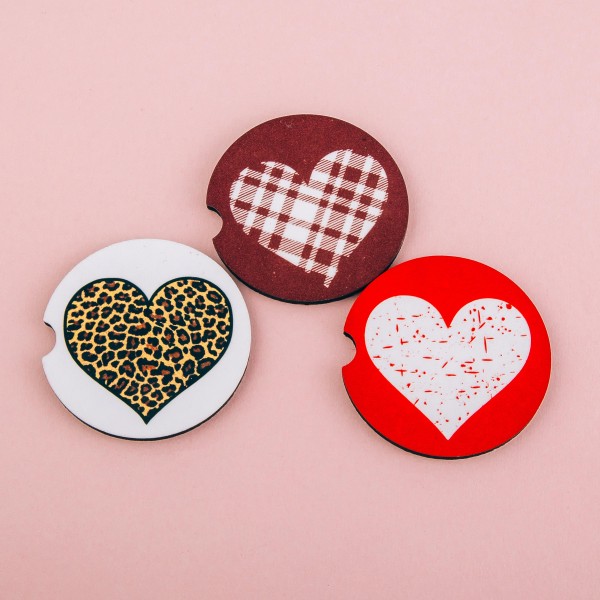 Leopard heart printed car coaster set.

- Pack Breakdown: 2pcs / pack
- Approximately 2" in diameter
- Finger slot for easy removal
- Condensation absorbing cork