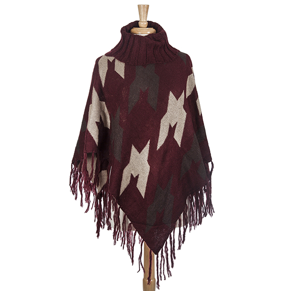 Burgundy, brown, and taupe aztec printed turtle neck poncho with oversized houndstooth pattern. Made from 100% acrylic. One size fits most.